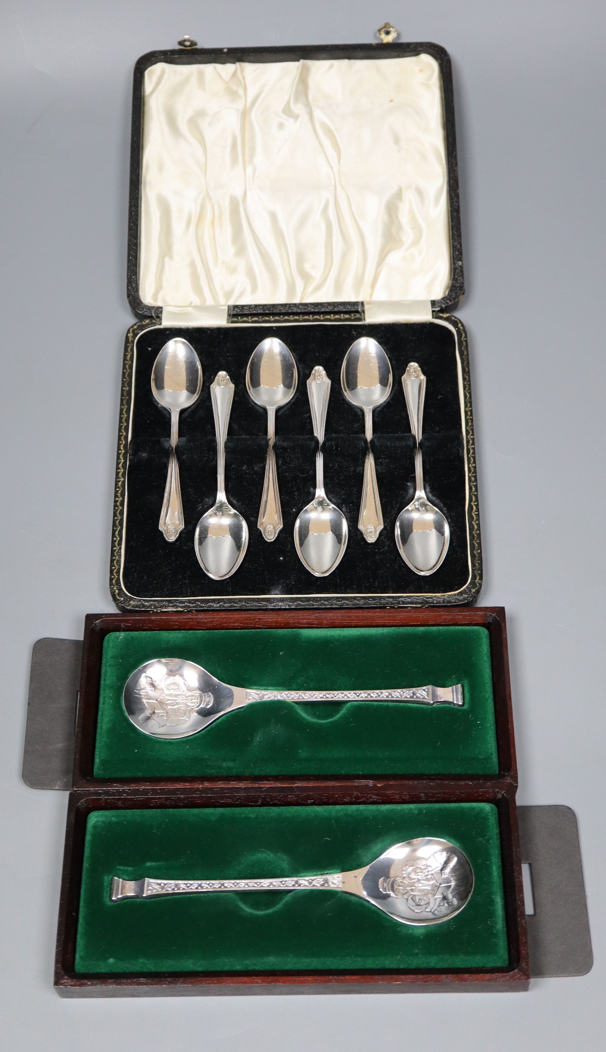 A cased set of six silver teaspoons and two single Christmas spoons